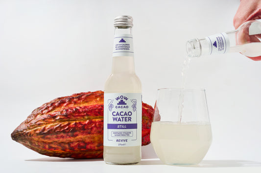 Wow Cacao Still Cacao Water 275ml shown served in a glass